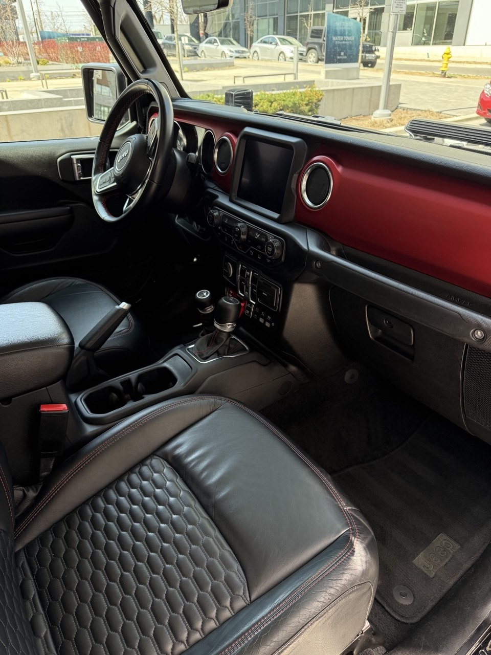Glossy black BMW SUV after detailing
