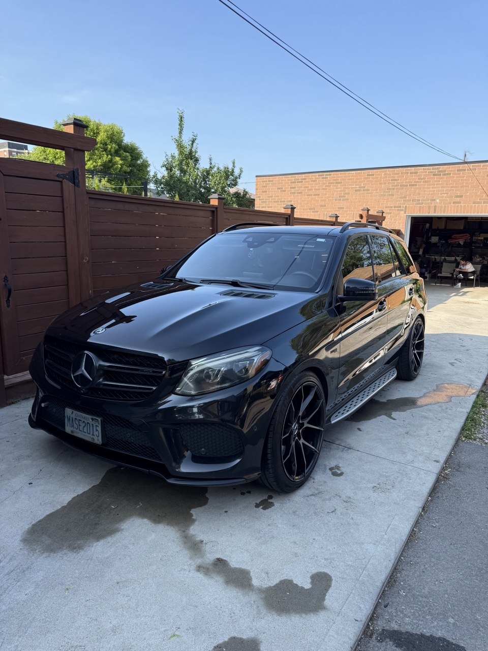 Detailed black BMW SUV parked in a driveway
